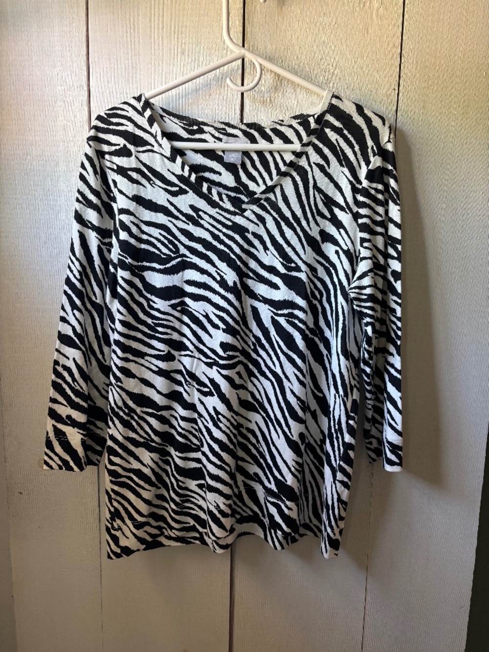 Woman’s Chico’s zebra print quarter sleeve top
